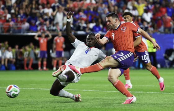 McGinn's Deflected Strike Sends Scotland to the Top of Group C