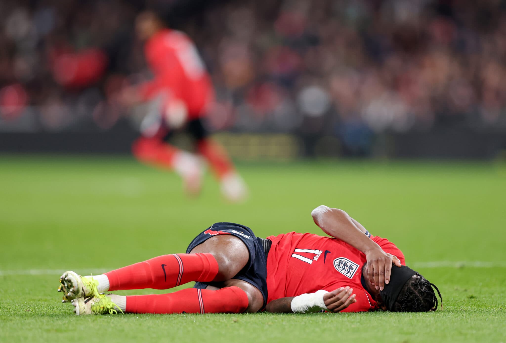 Arsenal's Injury Crisis Deepens: Madueke Leaves Wembley in Knee Brace as Rice and Saka Also Return Early